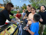 kids and parents line up for hotdogs at Dobson Ranch 2020 Movie in the Park event