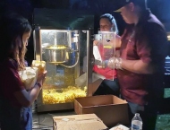 kids getting popcorn at Dobson Ranch 2020 Movie in the Park event