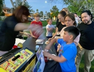 kids and parents getting hot dogs at Dobson Ranch 2020 Movie in the Park event
