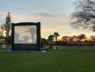 large outdoor screen at sunset at Dobson Ranch 2020 Movie in the Park event