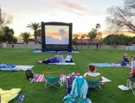 residents set up chairs and blankets in park at Dobson Ranch 2020 Movie in the Park event