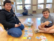 two boys playing games on floor at Dobson Ranch  2020 Parents Night Out event
