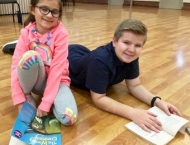 brother and sister reading at Dobson Ranch  2020 Parents Night Out event