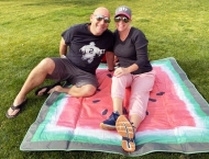 husband and wife on blanket in park  at Dobson Ranch 2020 Sunday in the Park event