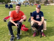 two men sitting in folding chairs in park  at Dobson Ranch 2020 Sunday in the Park event