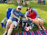 man and wife relaxing in park  at Dobson Ranch 2020 Sunday in the Park event