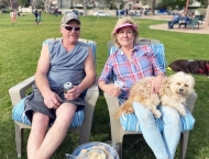 husband and wife in lawn chairs with dog  at Dobson Ranch 2020 Sunday in the Park event