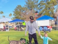 dad and son with dog at Dobson Ranch 2020 Winter Bark in the Park event