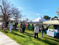 residents visit vendor booths at Dobson Ranch 2020 Winter Bark in the Park event