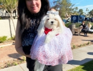woman holding her princess pooch at Dobson Ranch 2020 Winter Bark in the Park event