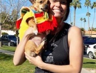 woman holding dog in taco costume at Dobson Ranch 2020 Winter Bark in the Park event